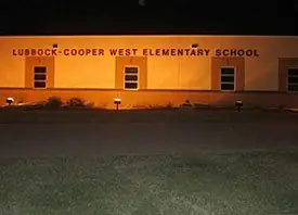 Lubbock-Cooper West Elementary School lit along its front elevation at night
